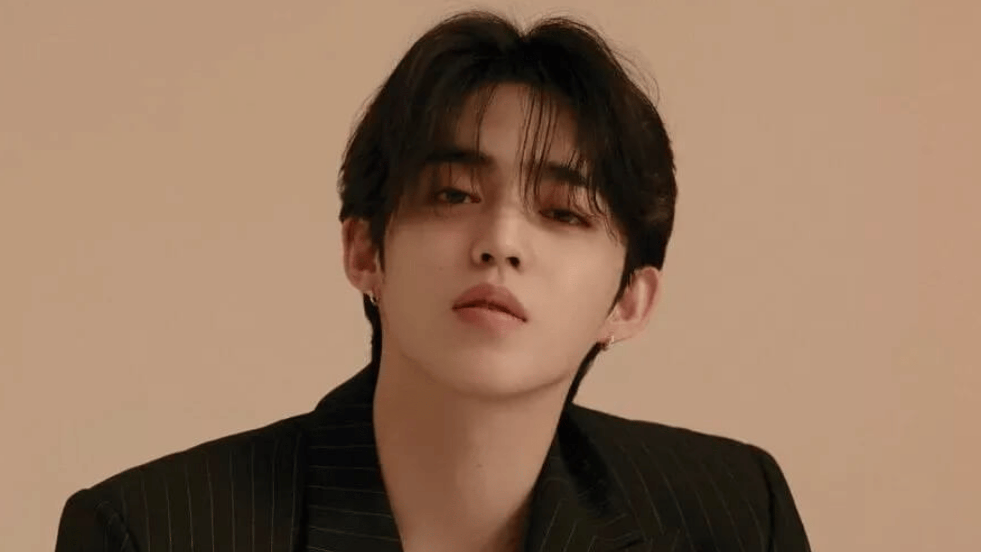 Hoshi of seventeen posing confidently in a portrait photo with a stylish look