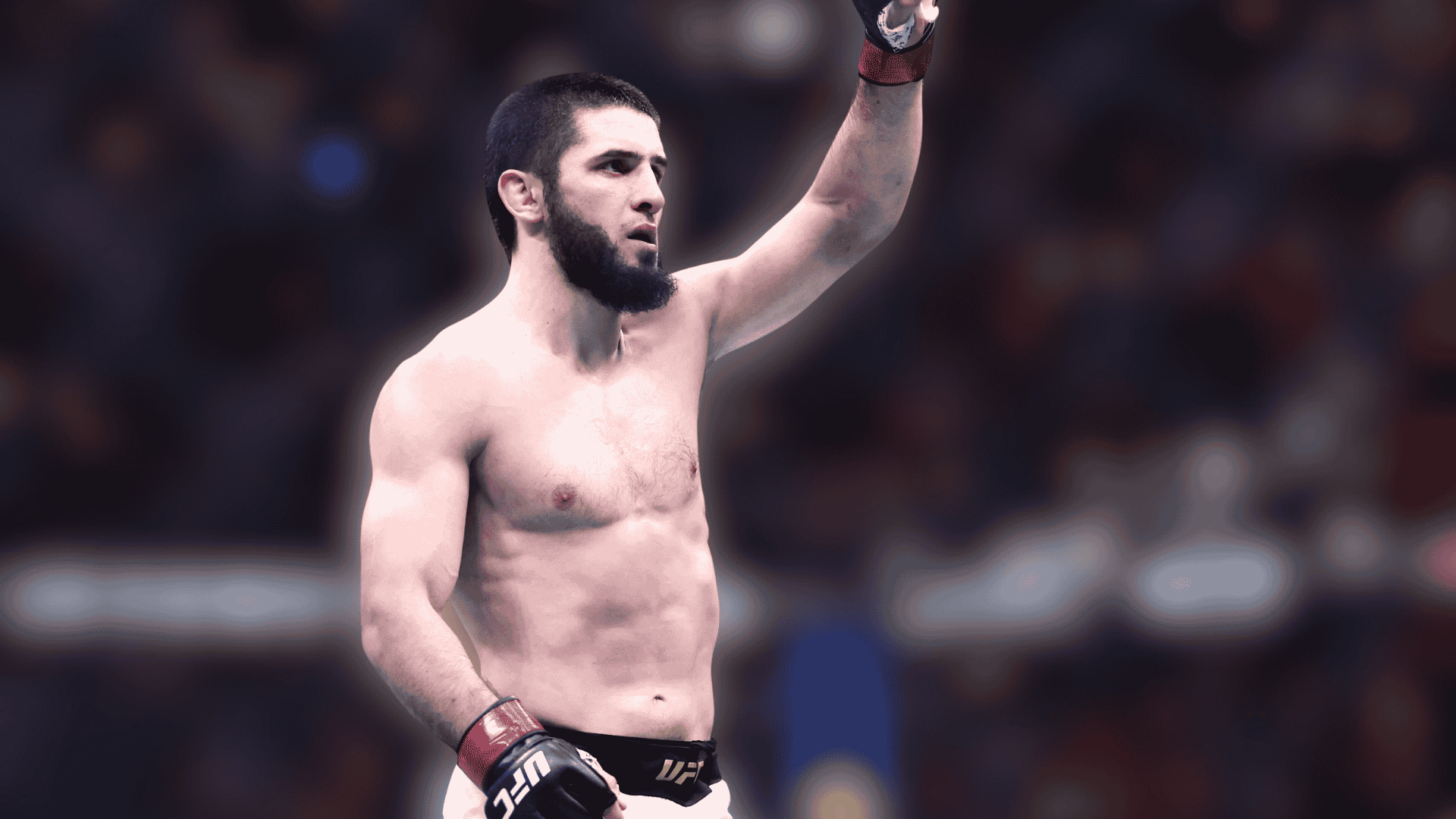 islam makhachev raising one arm inside the octagon during a ufc event