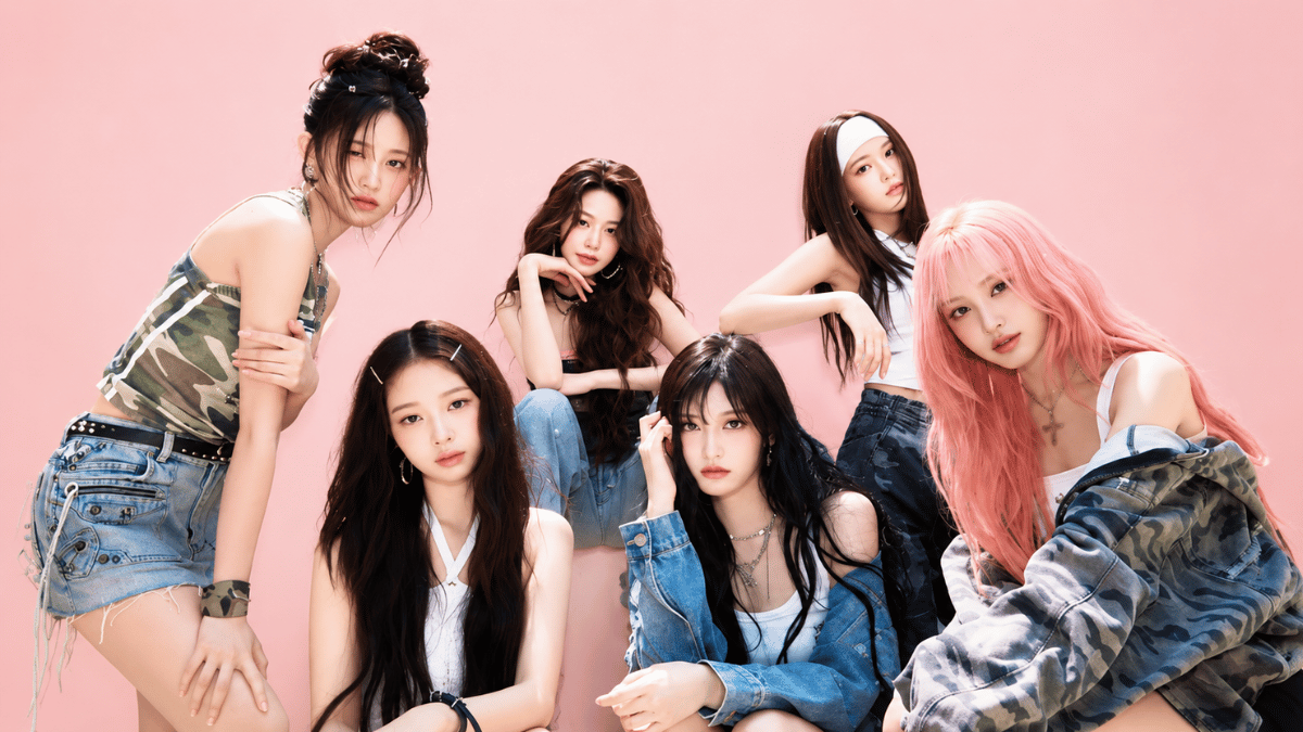ive members posing in colorful outfits on a pastel pink background