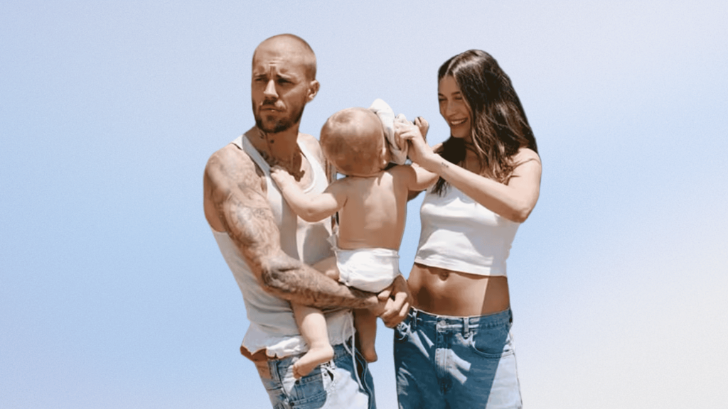 Justin and Hailey Bieber holding son Jack Blues Bieber outdoors.