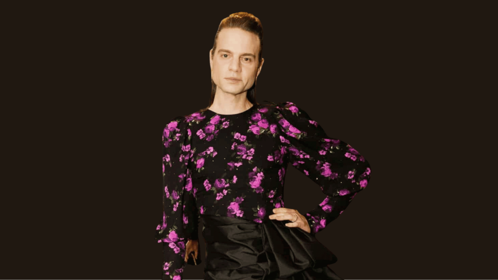 jordan roth in floral top and dramatic dark skirt