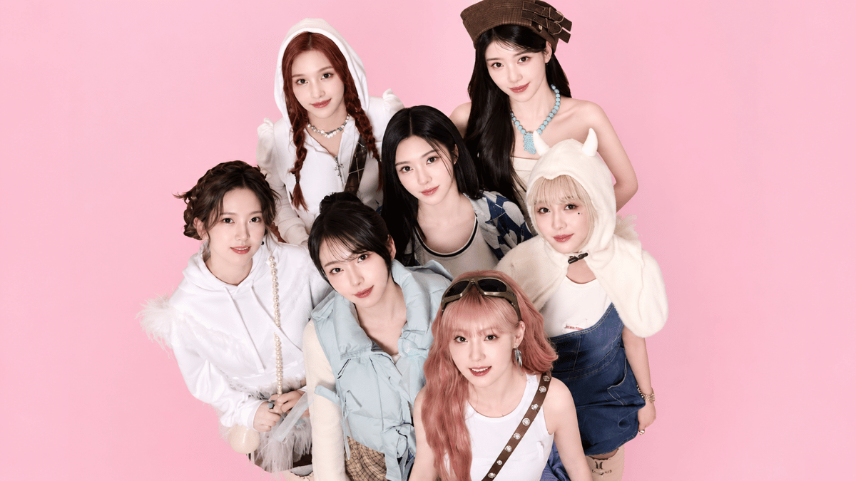 kep1er members posing in elegant black outfits on a pastel pink background