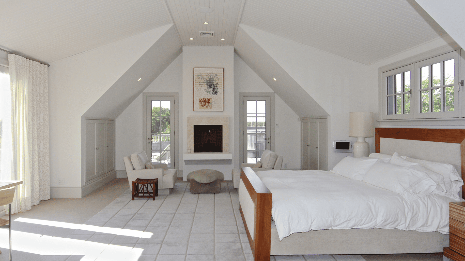 master bedroom suite in obama martha vineyard home with vaulted ceiling fireplace ocean view minimalist design calm spacearea