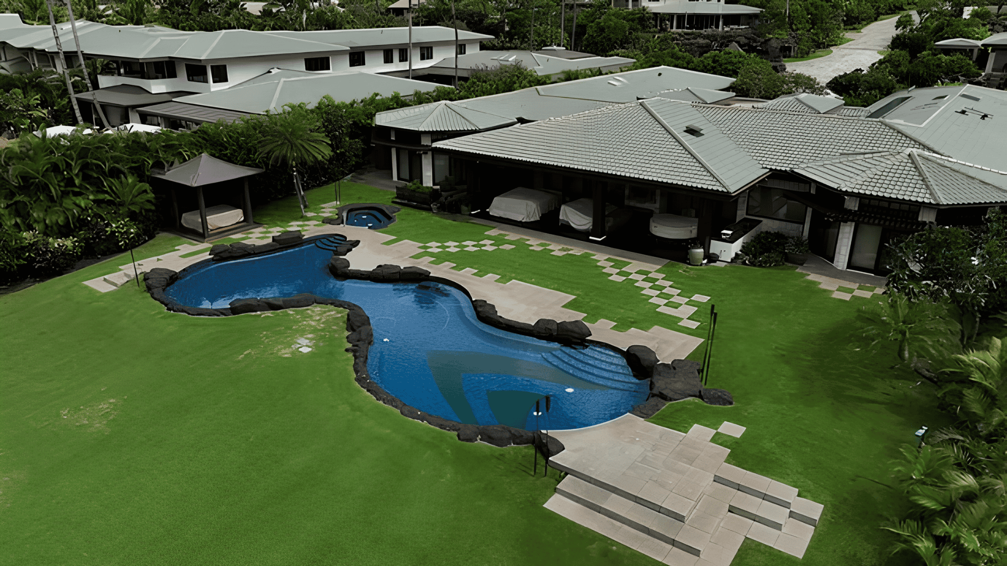 maui oceanfront home with pool and green lawn