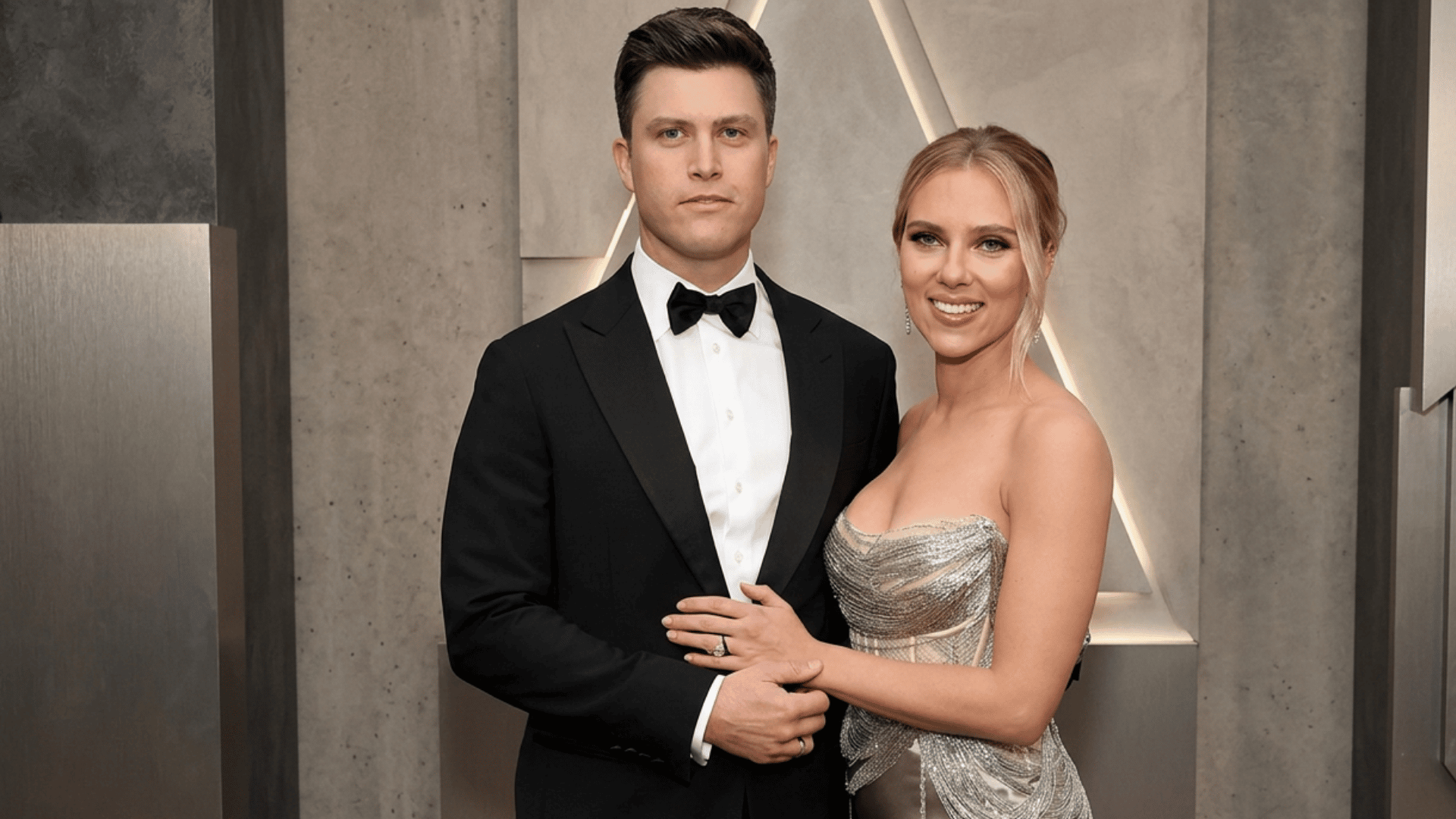 carlett Johansson and Colin Jost pose together at event