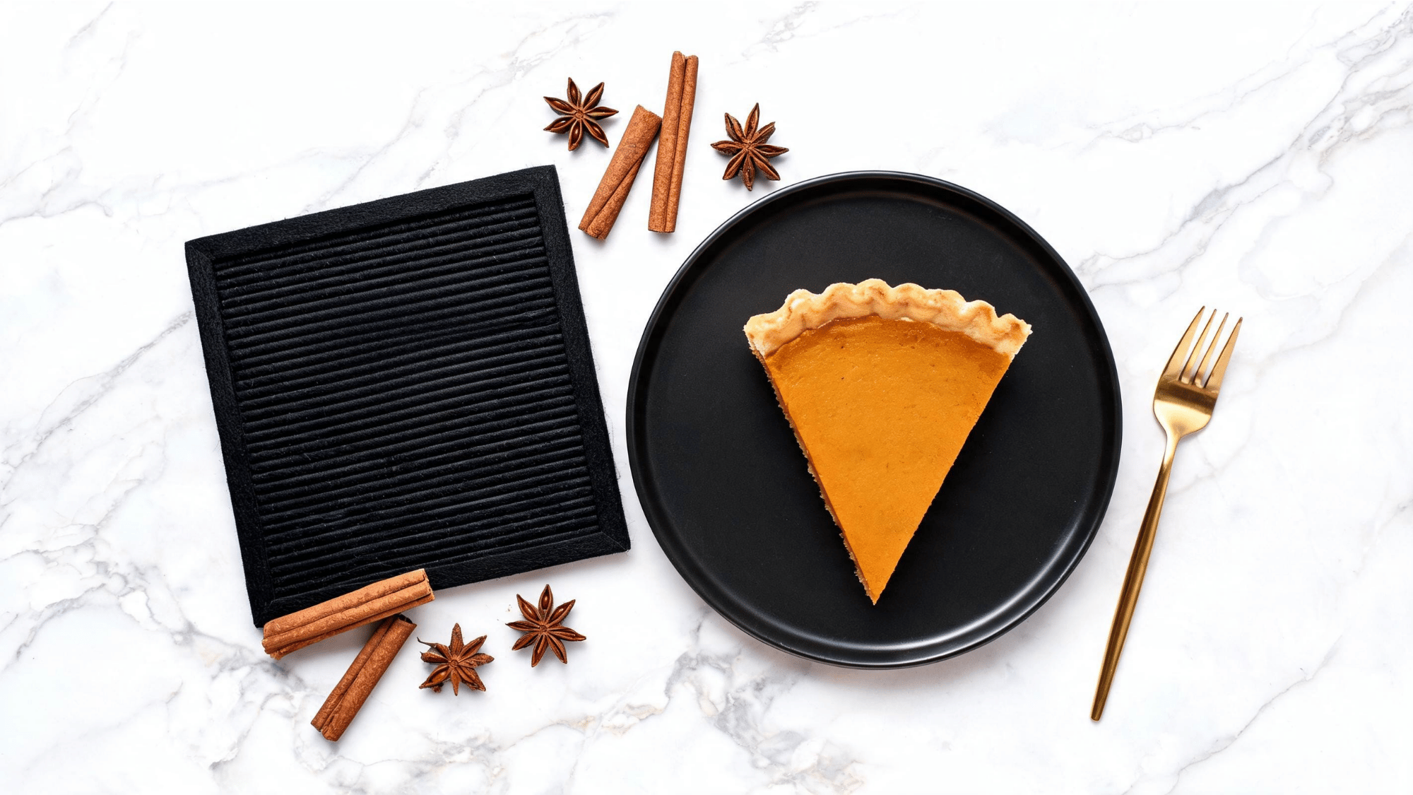 slice of pumpkin pie next to a funny thanksgiving letter board on a marble counter