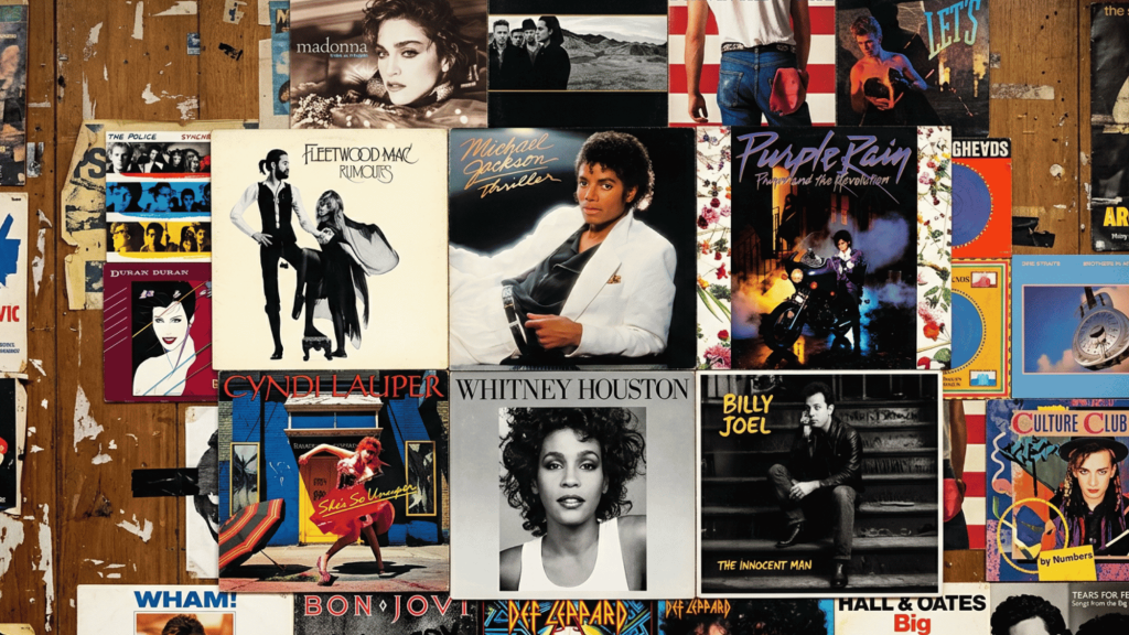 Collage of bestselling music album covers displayed together on a wall