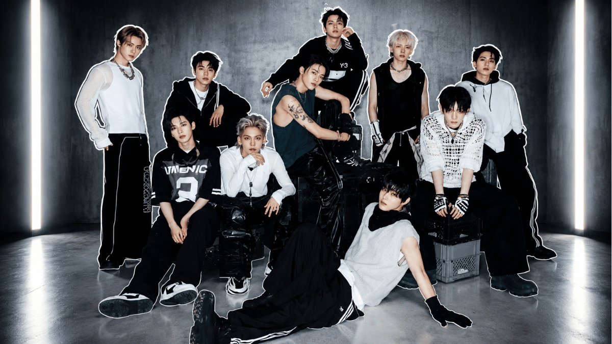 TREASURE members posing in a dramatic industrial studio settingTREASURE members posing in a dramatic industrial studio setting