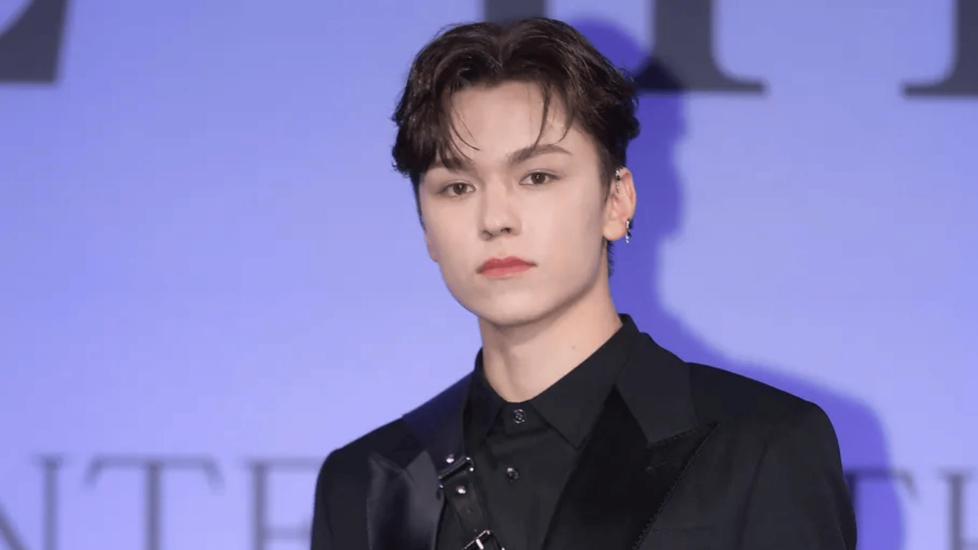 Vernon of seventeen posing in a close-up portrait with a relaxed expression