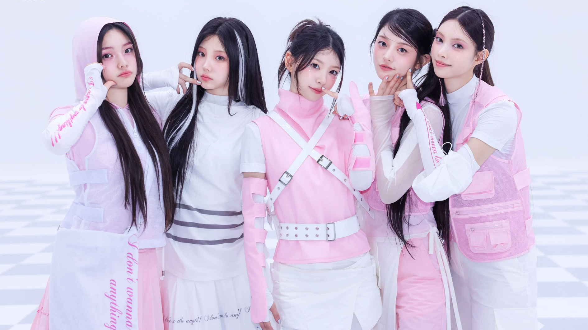 illit members posing in pink and white outfits