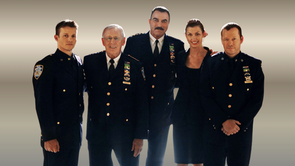 blue bloods cast photo showing the five main reagan family actors in nypd uniforms
