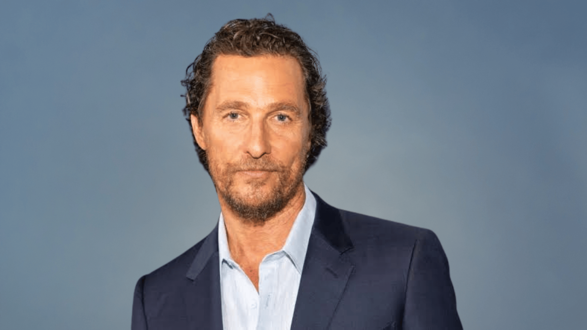 Matthew McConaughey wearing a suit at a formal event