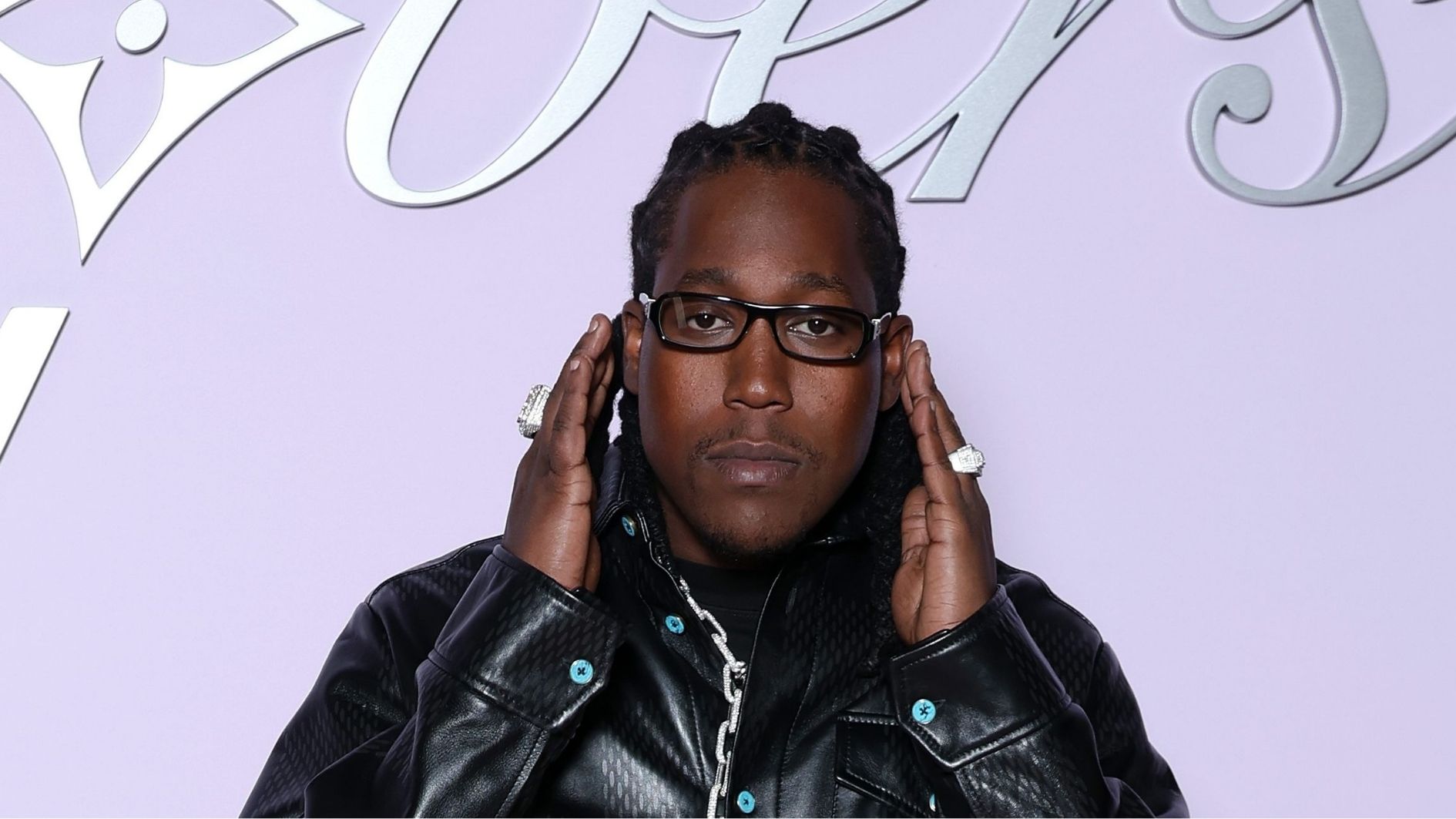 don toliver posing in a public event