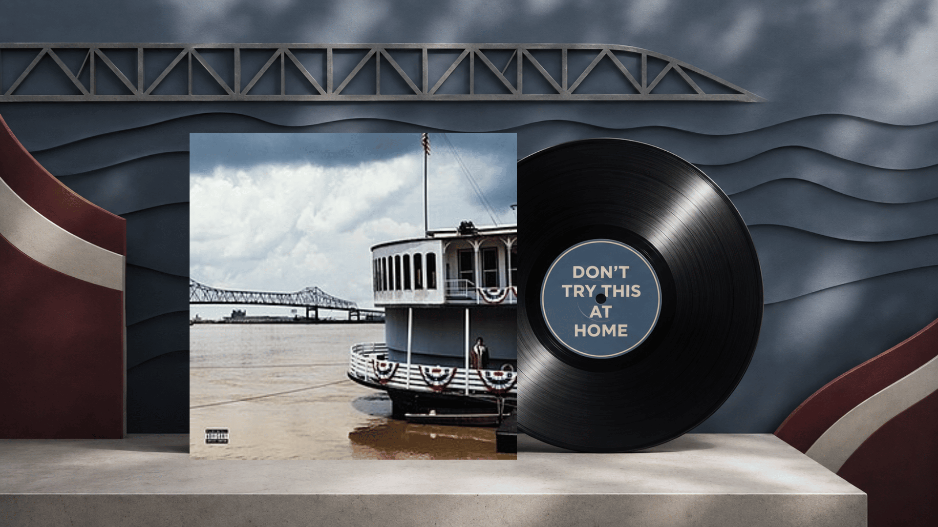 don’t try this at home album cover beside a vinyl record on a river-themed set