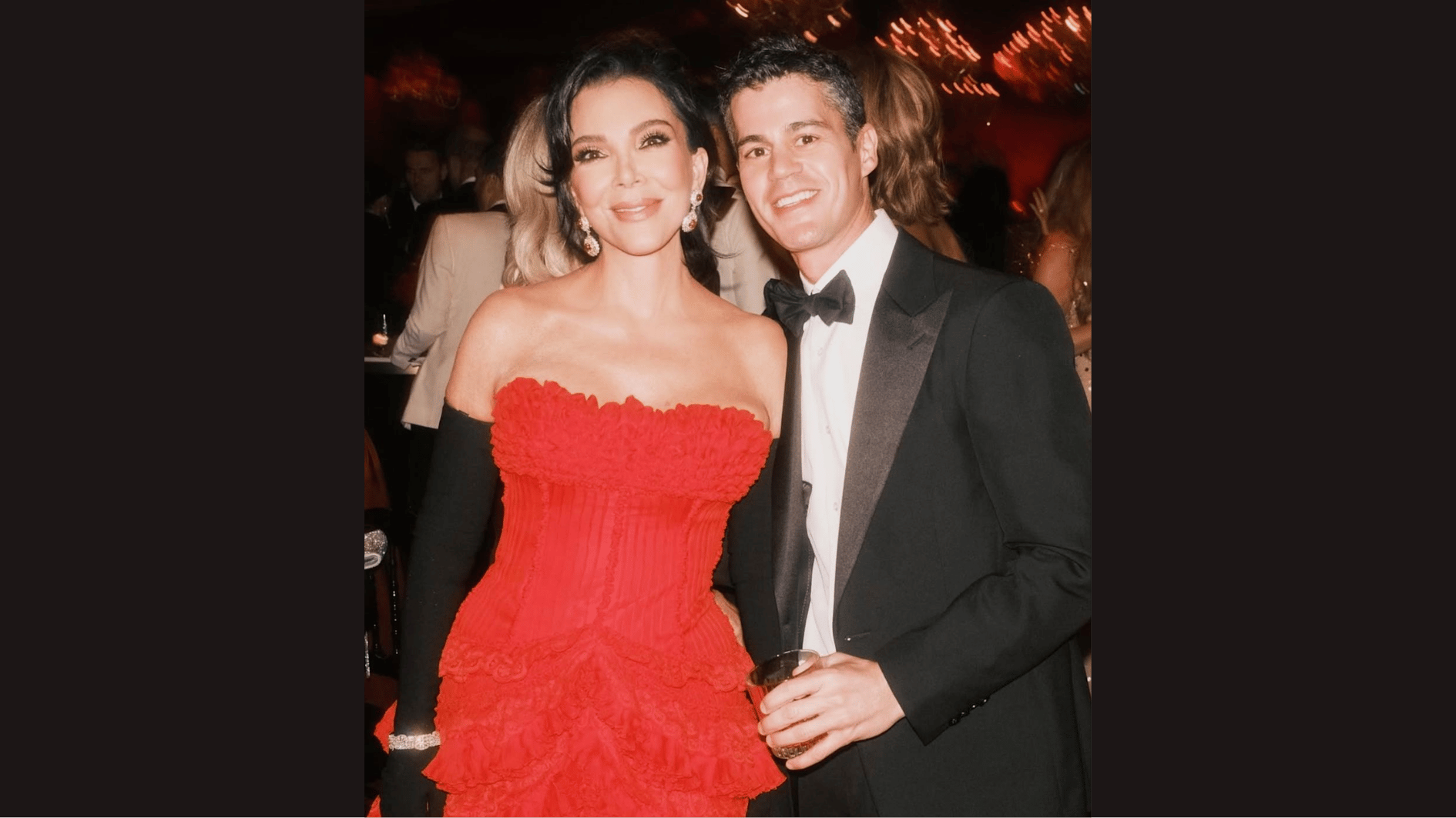Dr. Steven Levine poses beside Kris Jenner at an indoor event.