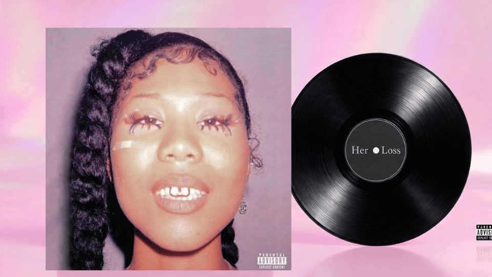 Drake’s Her Loss album cover beside a black vinyl recordDrake’s Her Loss album cover beside a black vinyl record