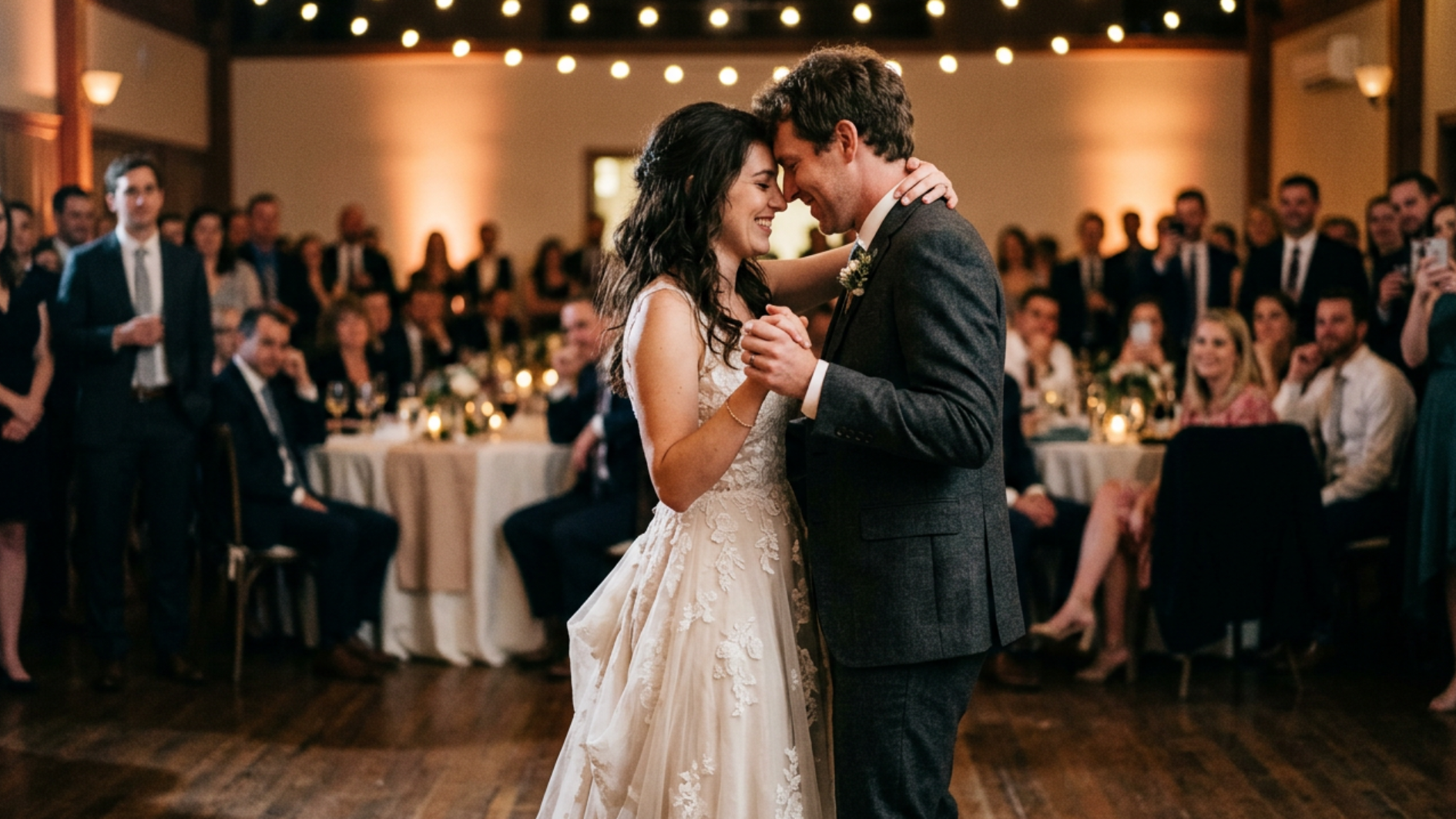 newlywed couple sharing their first dance before wedding guests