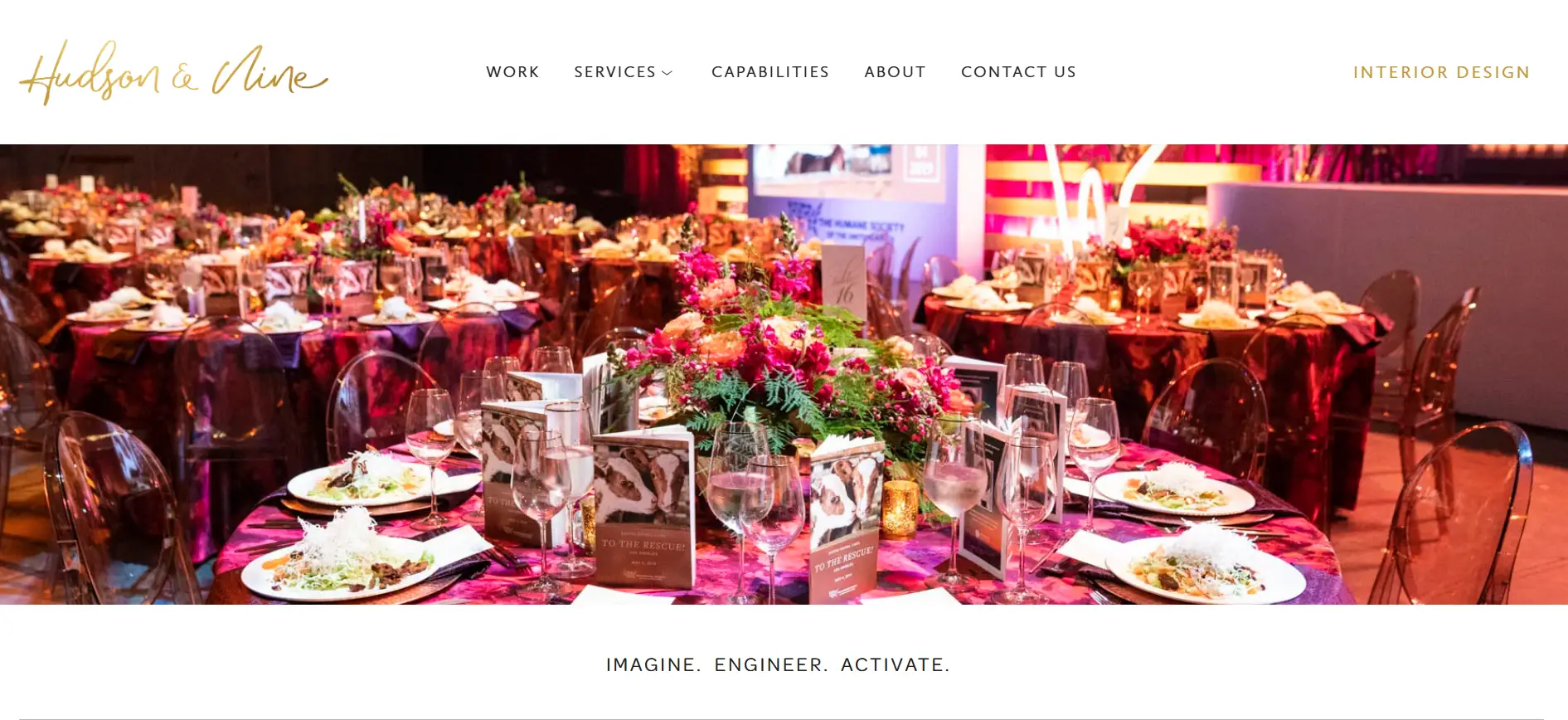 Elegant banquet tables with floral centerpieces and glassware in a dimly lit event space