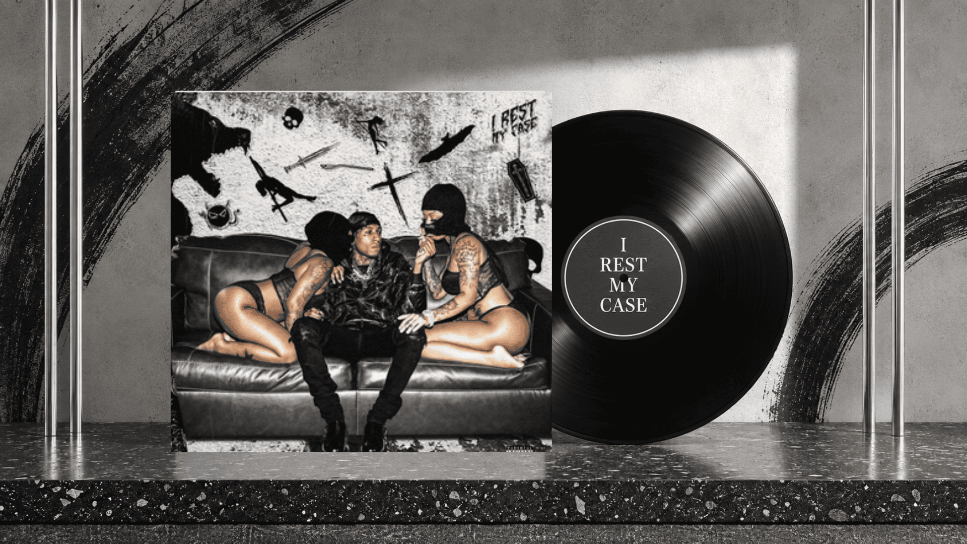 i rest my case album cover beside a black vinyl record on a monochrome set