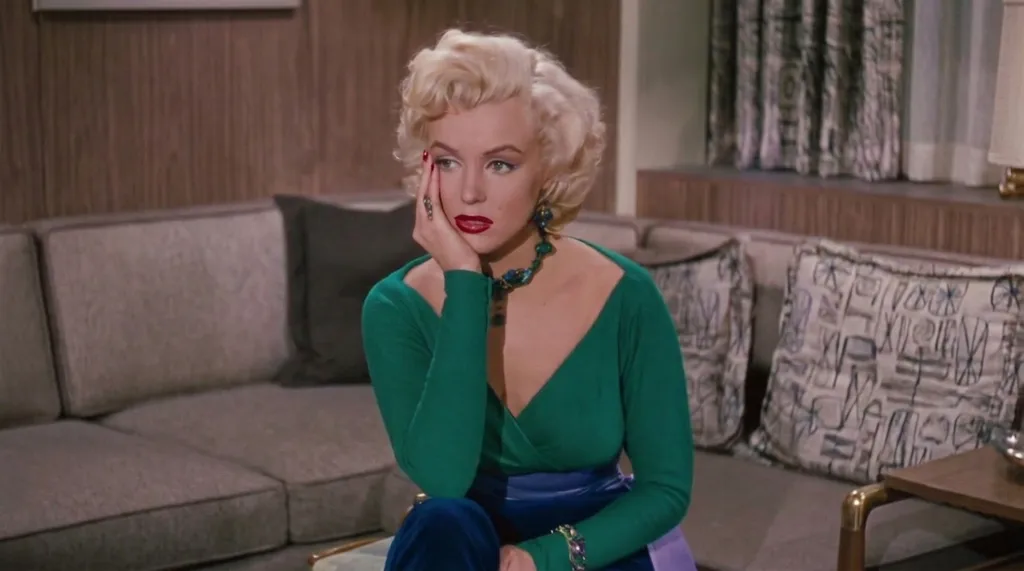 marilyn monroe wearing a shimmering emerald green saloon gown inside a warmly lit vintage western saloon