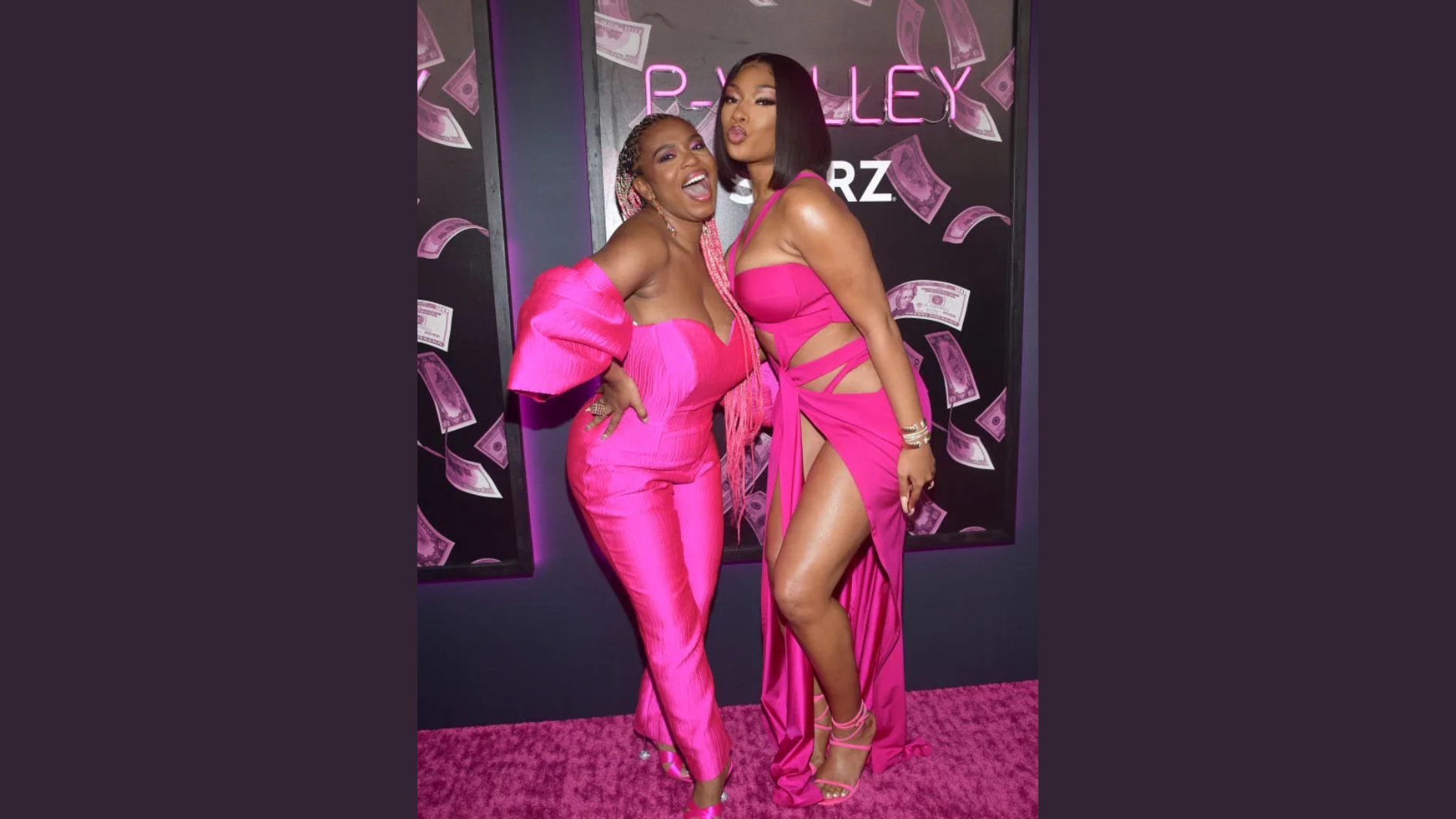 megan thee stallion posing beside a woman in pink