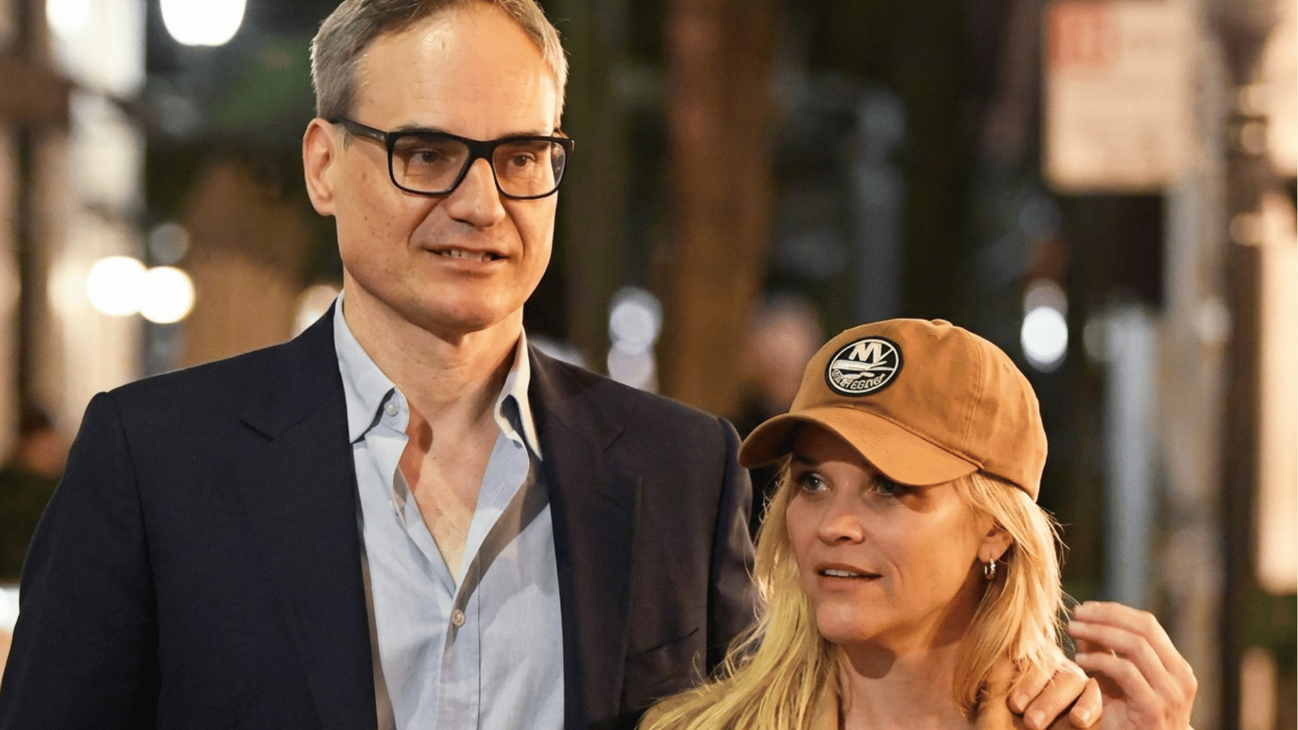 reese and oliver together hanging outside while both dressed in casual attire and are happy