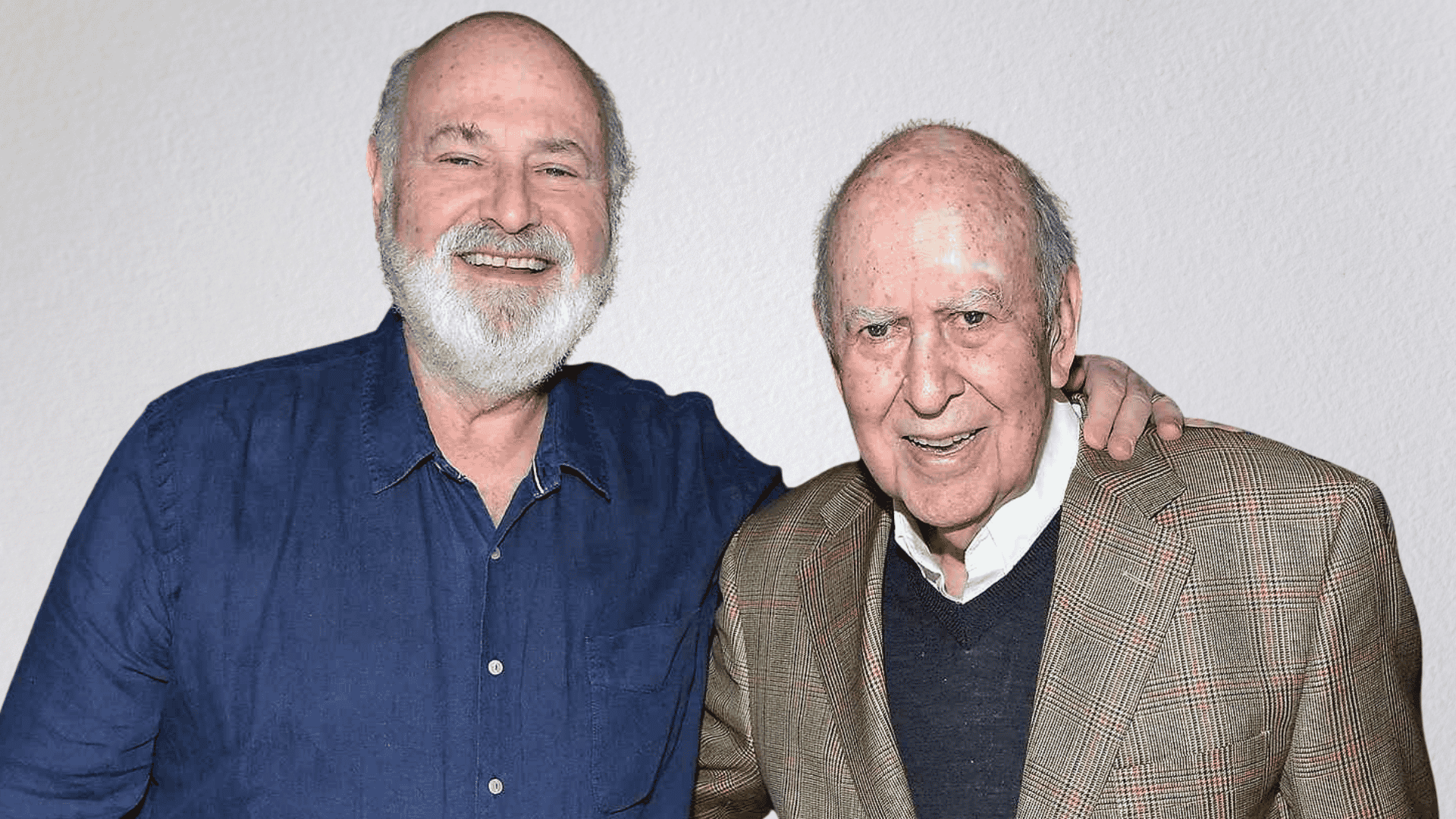 Rob Reiner standing with his father Carl Reiner at an event