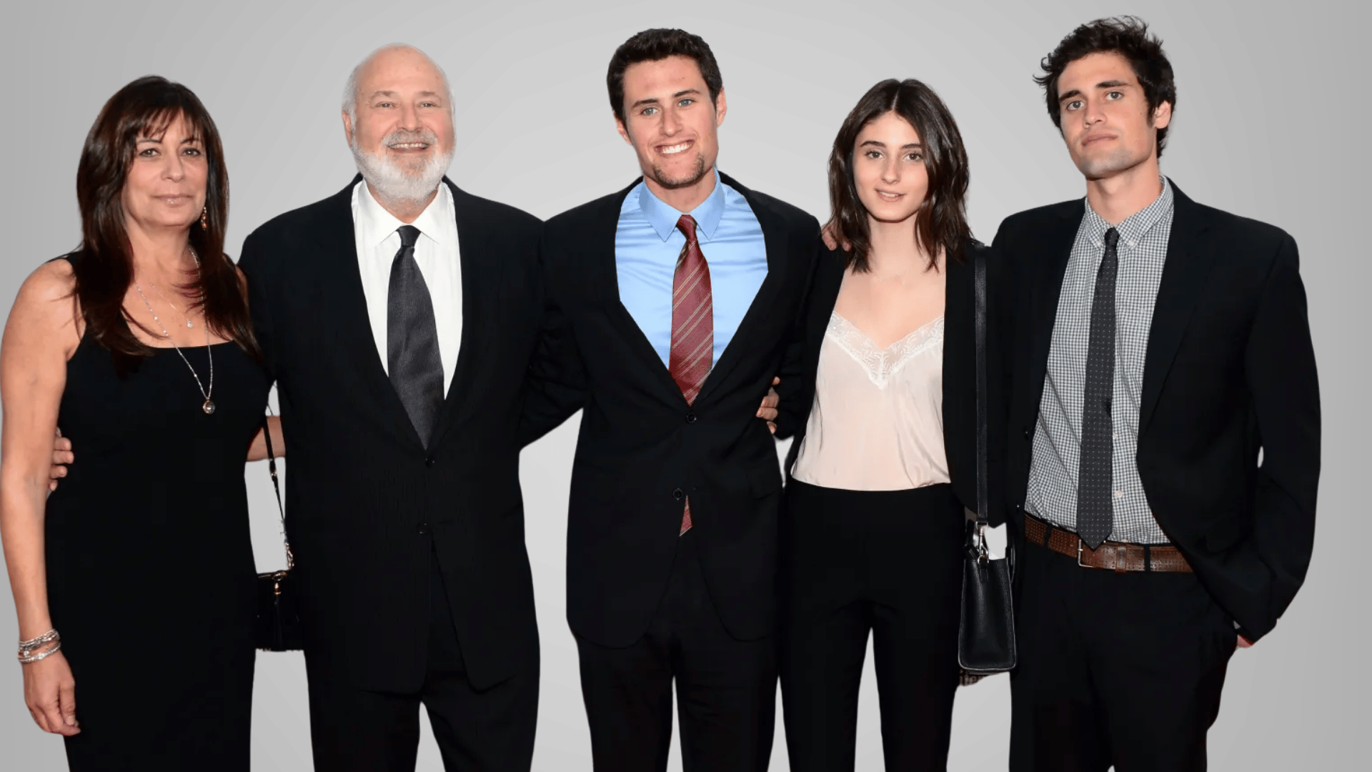 Rob Reiner posing with his family members at a formal event
