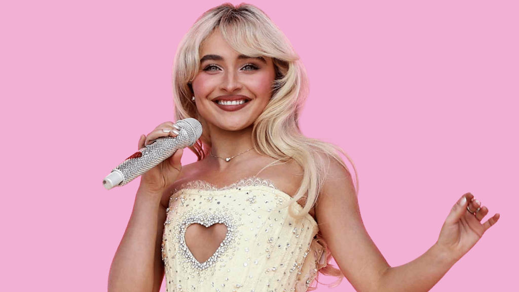 sabrina carpenter smiling with a jeweled microphone against a soft pink backdrop