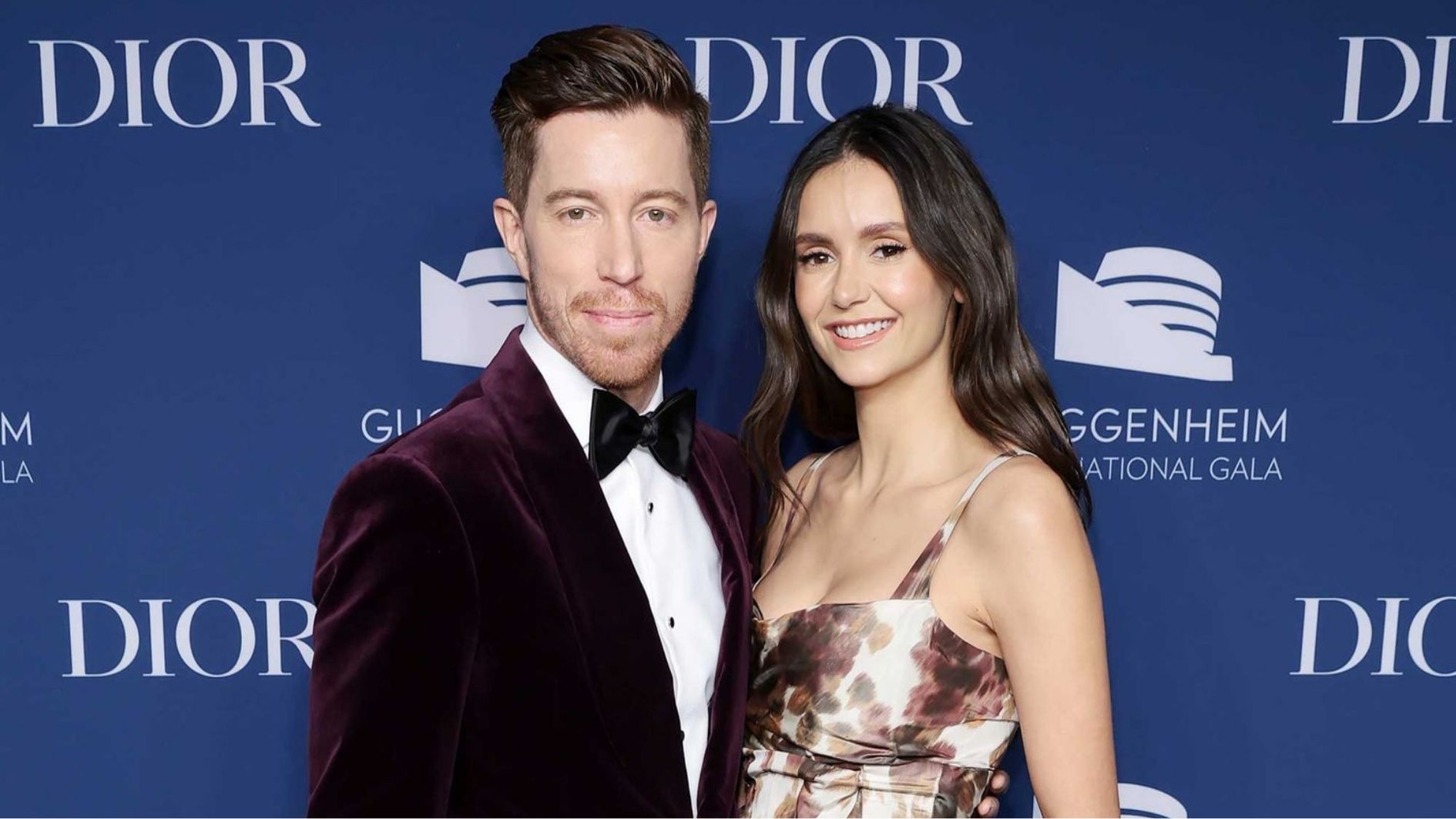 Shaun White and Nina Dobrev standing together at a formal public event