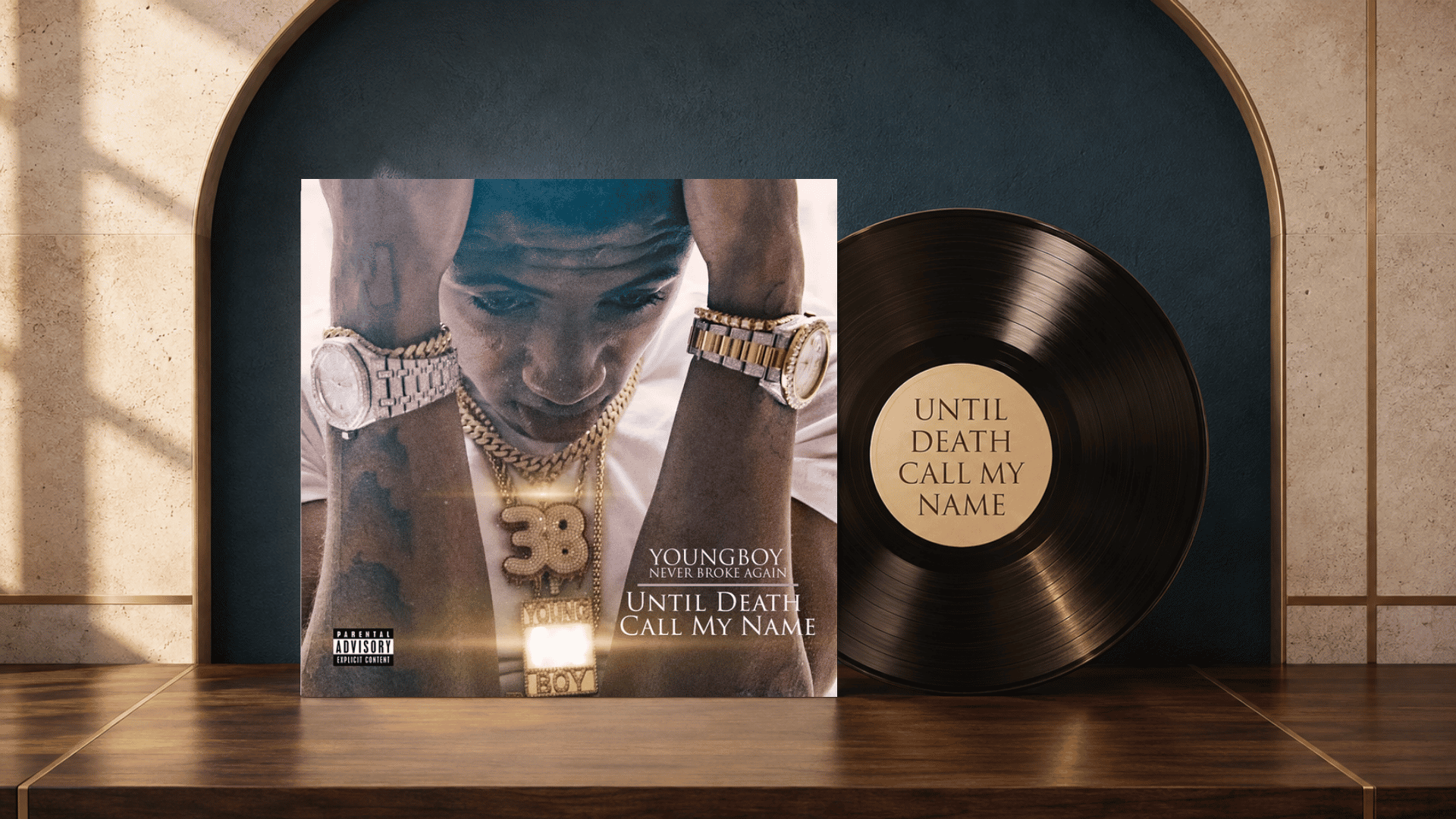 until death call my name cover beside a black vinyl record on a navy set