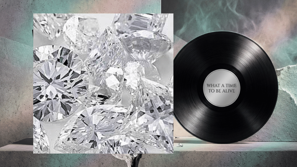 What a Time to Be Alive album cover beside a black vinyl record