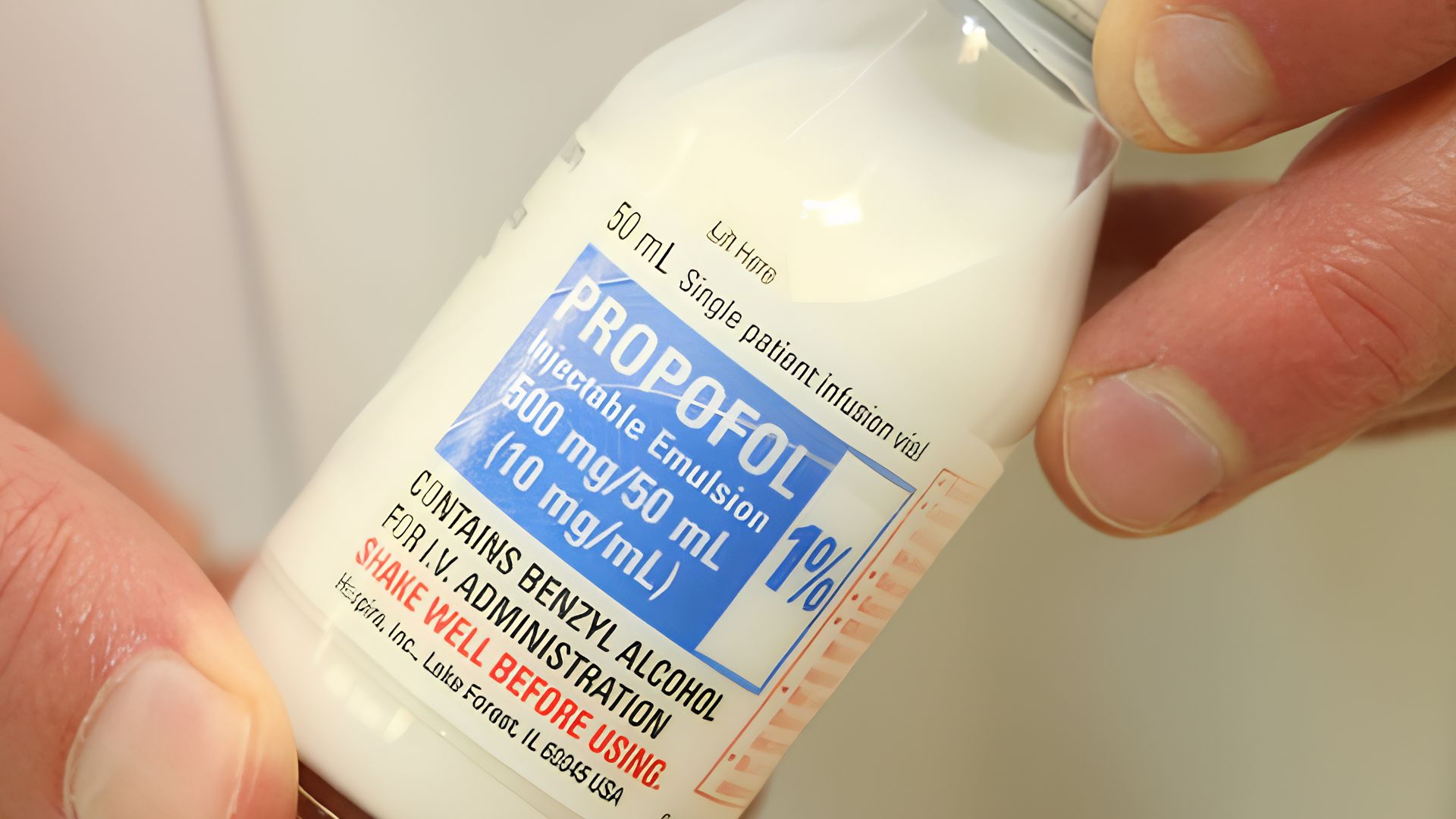 The image shows a 50 mL bottle of propofol, a white injectable medication labeled as a 10 mg/mL intravenous emulsion. The bottle also includes a warning to shake well before use.