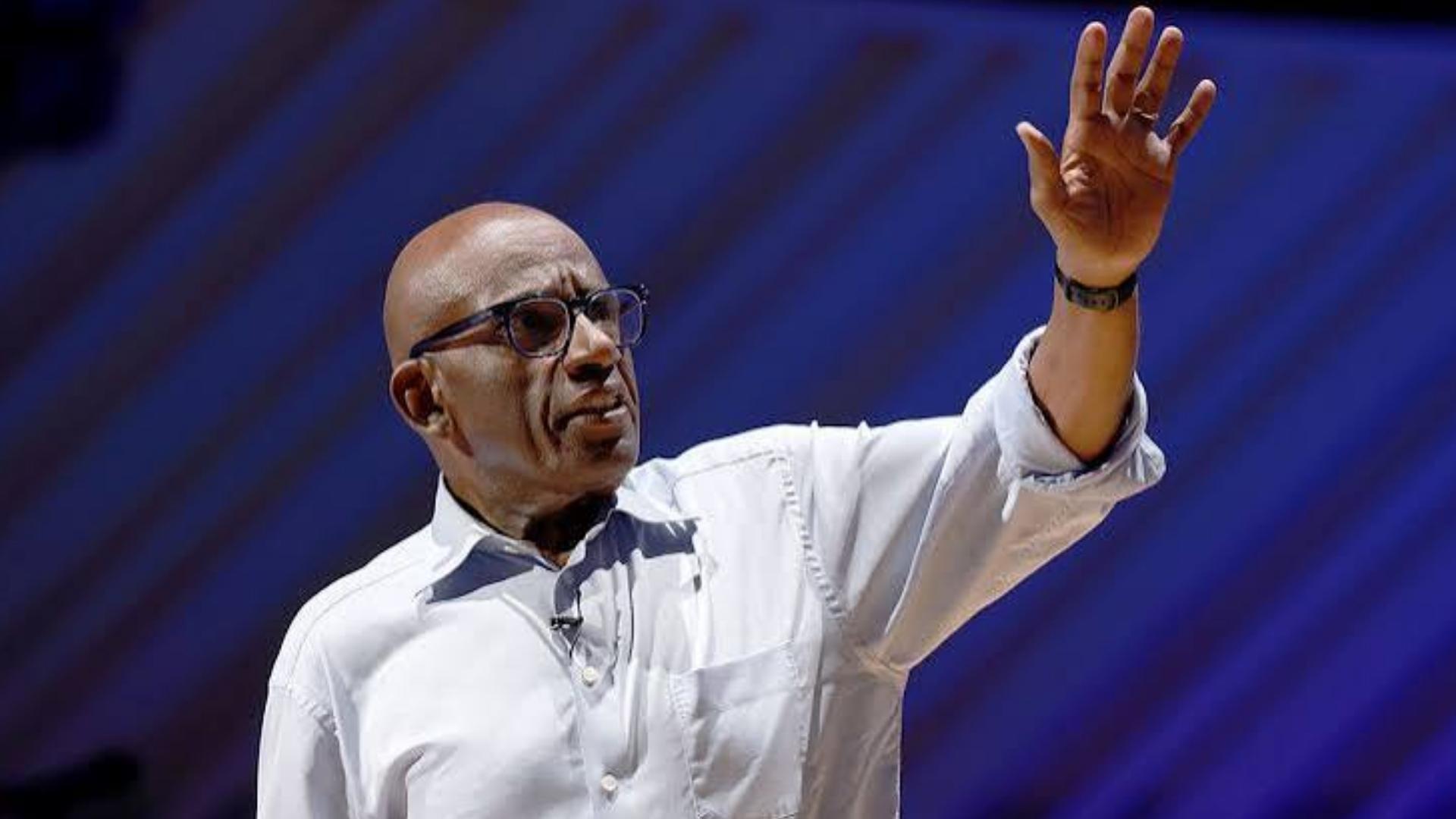 Al Roker speaking with one hand raised, wearing glasses and a white button-down shirt.