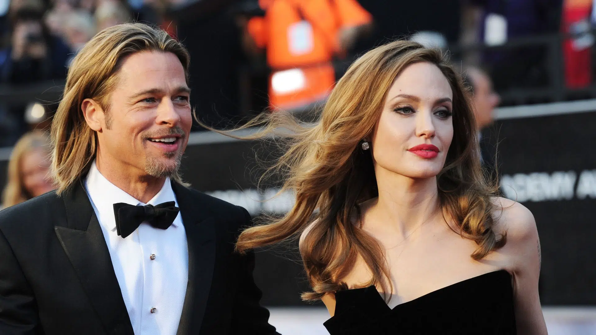 Brad Pitt and Angelina Jolie at a red carpet event together in formal attire before their split