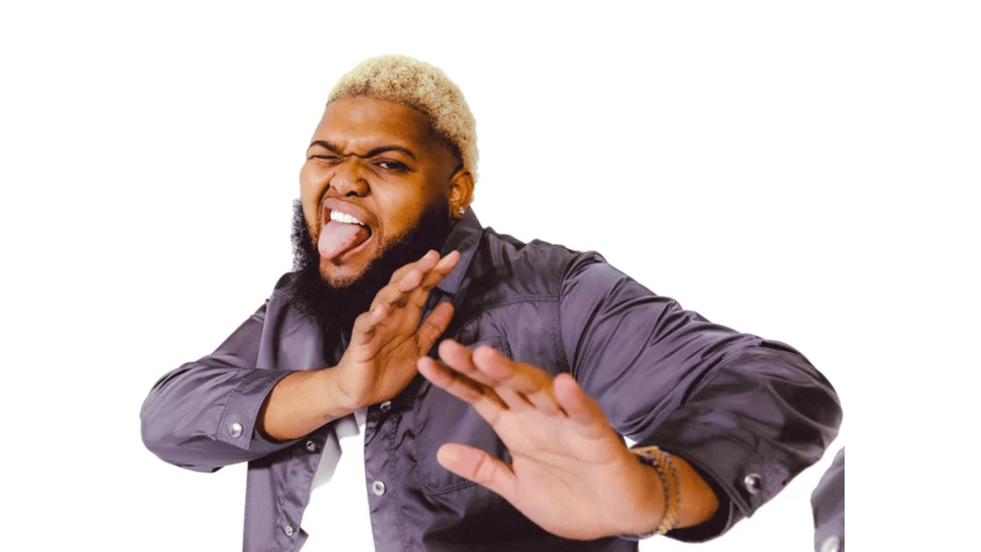 comedian druski with bleached hair sticks out his tongue and raises both hands toward the camera