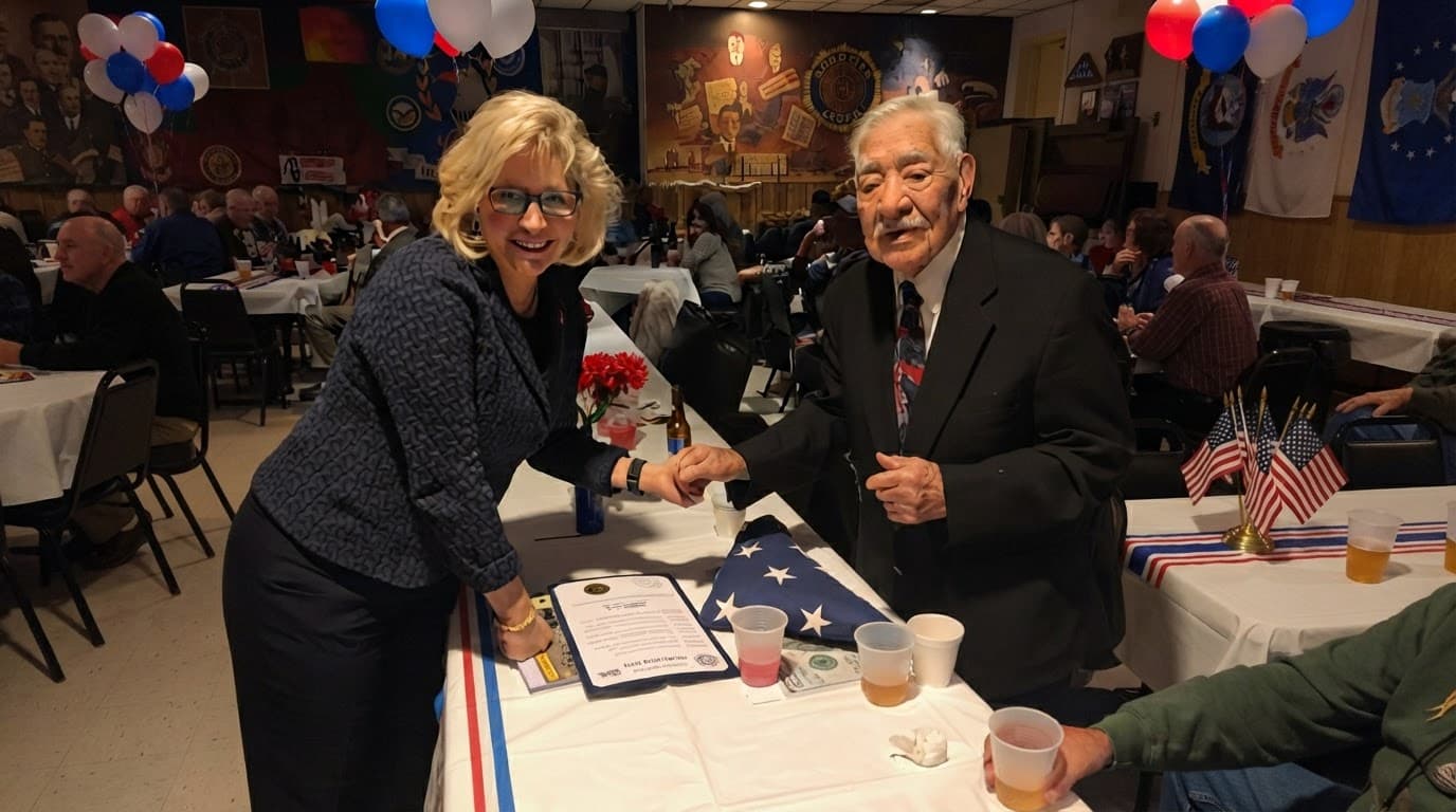 Liz Cheney shaking hands with an older man at a community event