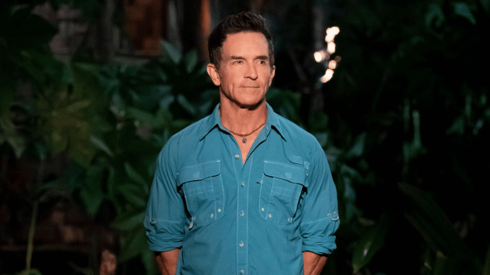 Jeff Probst standing at a Tribal Council set on the reality competition series Survivor.