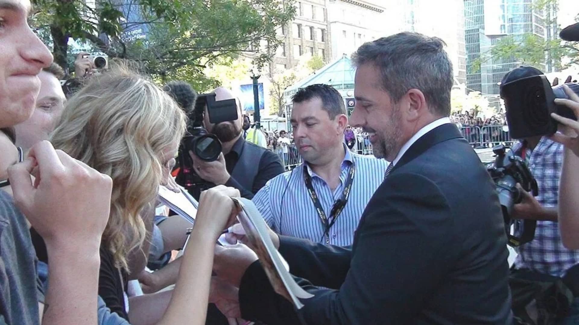 Steve Carrell about to sign an autograph for a fan at TIFF