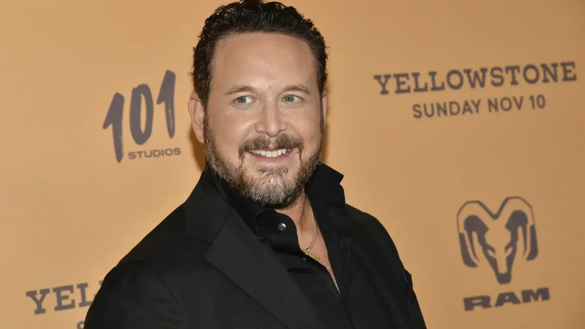 cole hauser at yellowstone event wearing black outfit representing rip wheeler role and acting career success