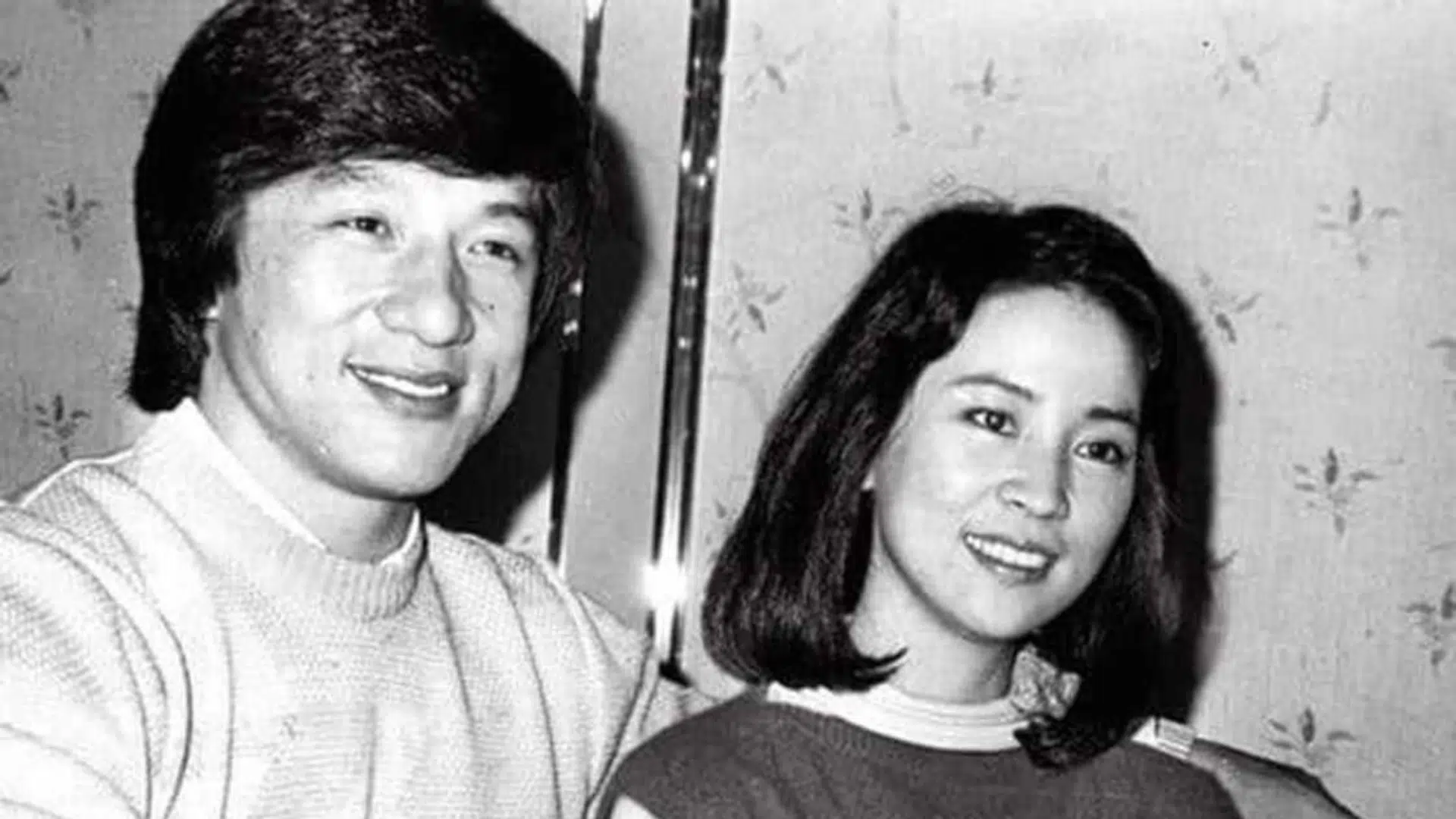 jackie chan and joan lin smiling together in a black-and-white photo from their early marriage