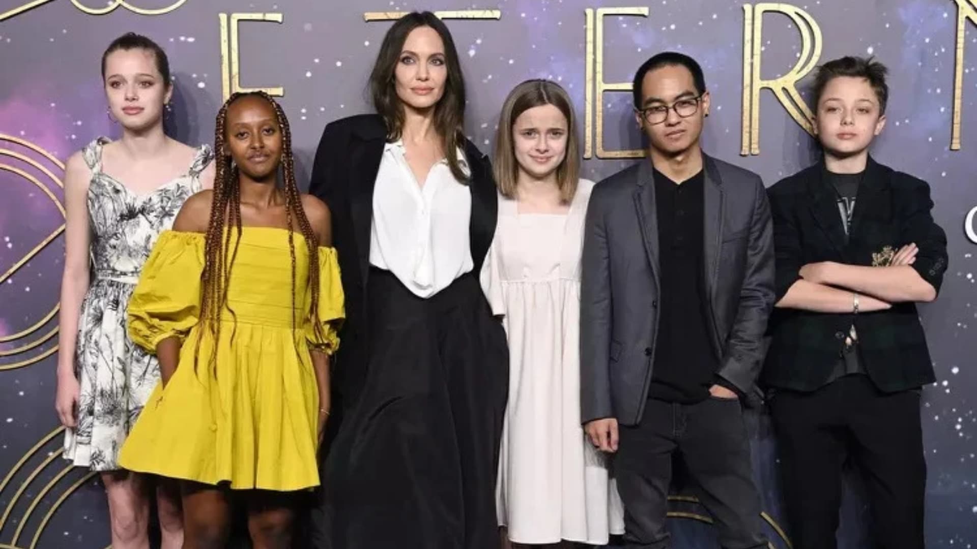 angelina jolie posing with her six children at a public event