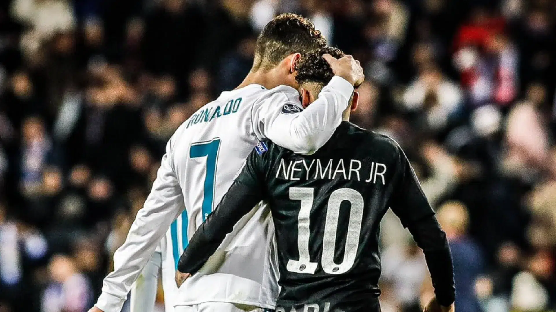 two soccer players in white number 7 and black number 10 jerseys walking together with arms around each other on the field