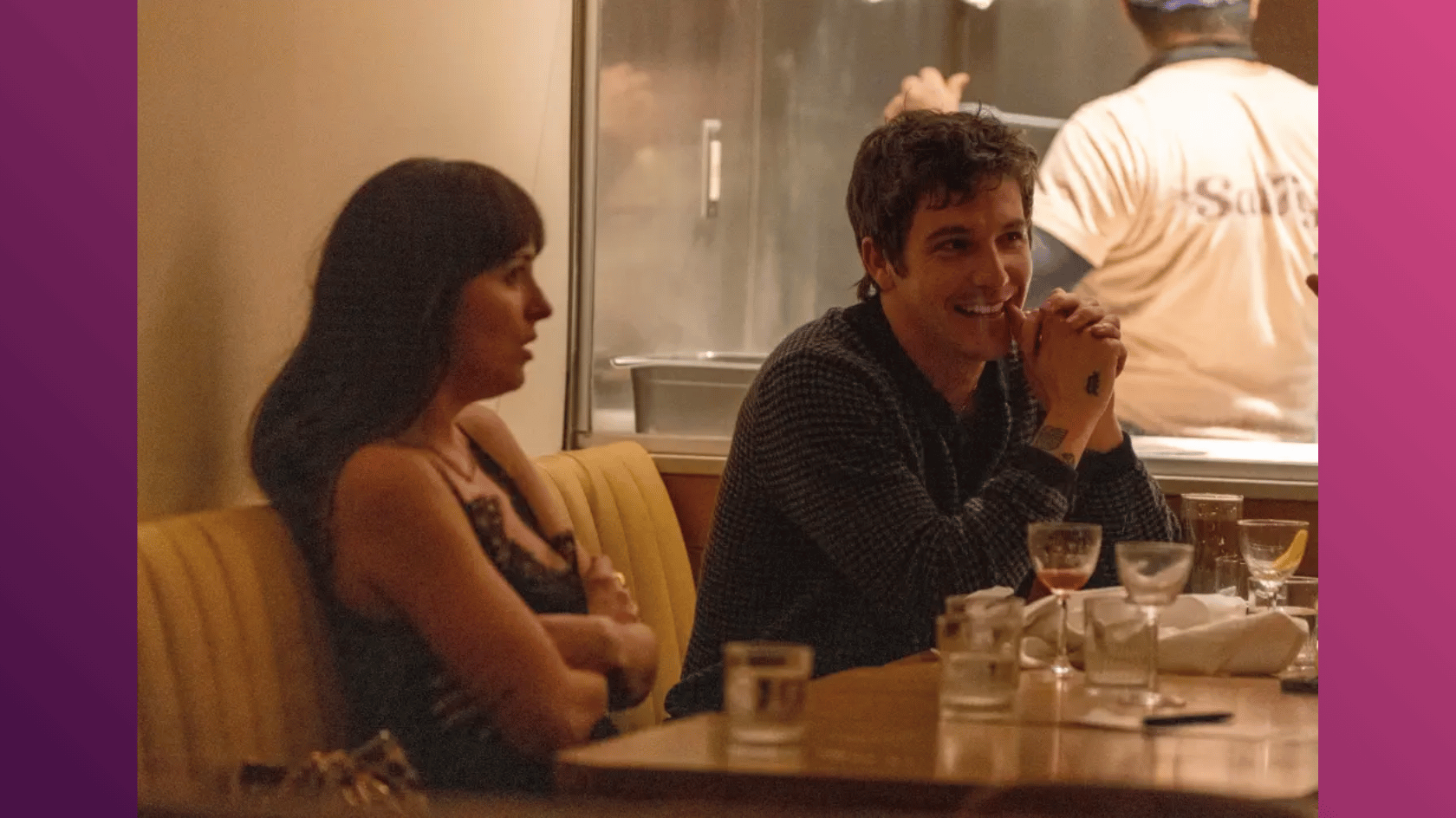 role model and dakota johnson dining together in a restaurant