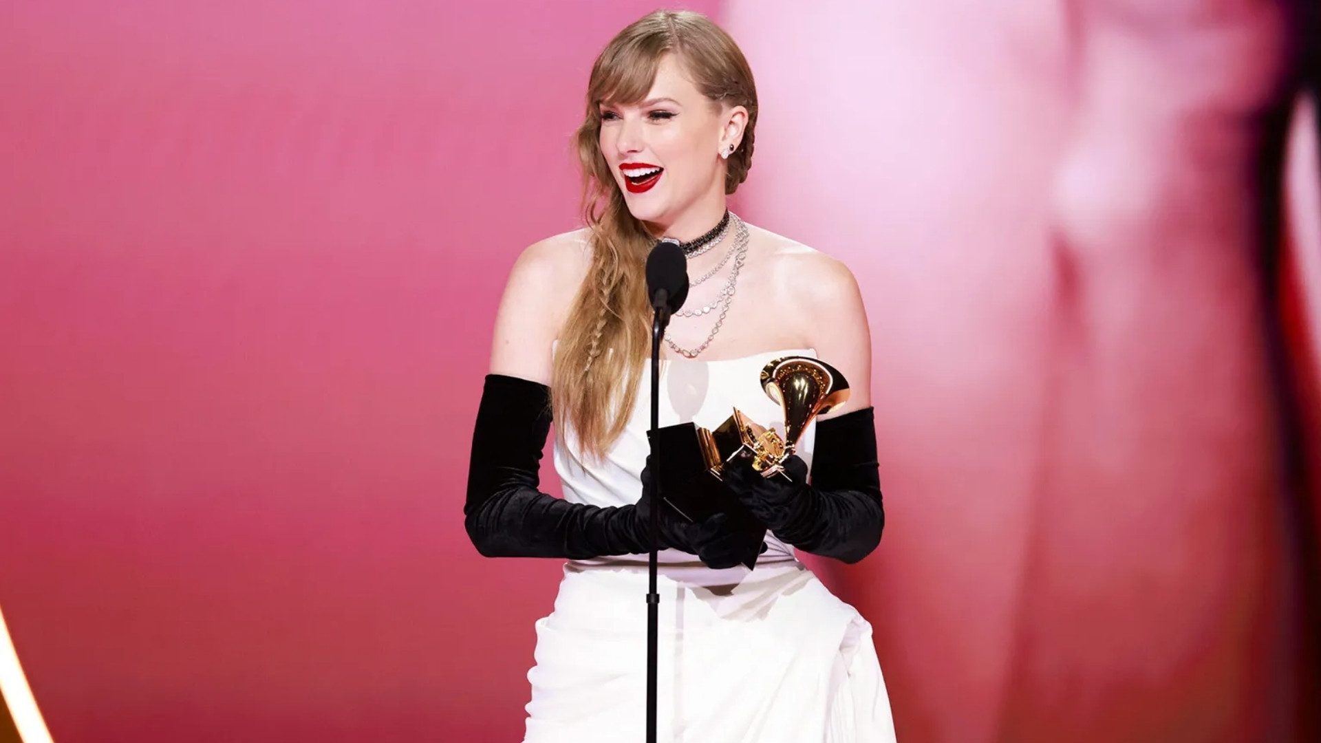 Taylor Swift accepting her Grammy Award at the 66th Grammy Awards ceremony