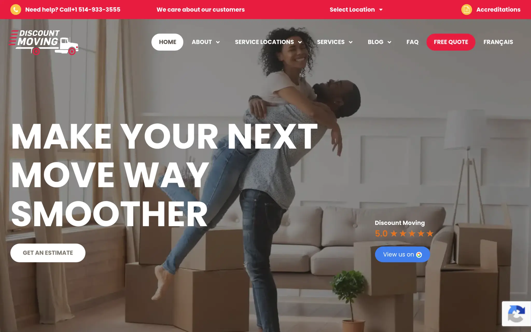 Couple embracing in living room with moving boxes and beige couch