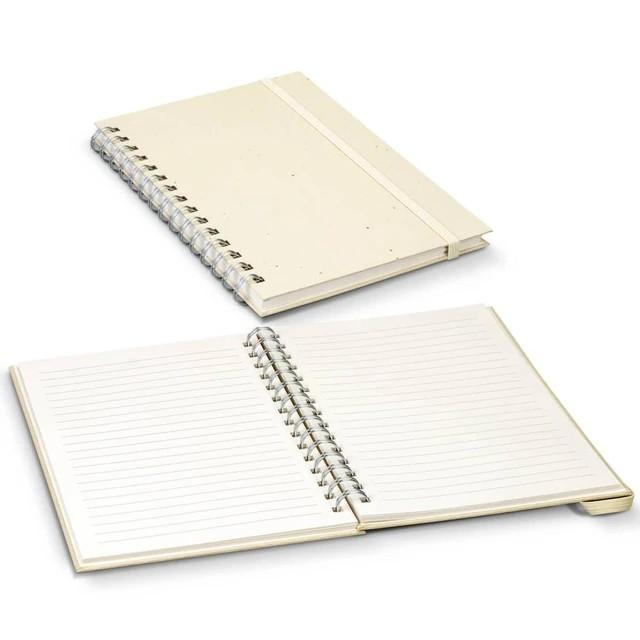 Two spiral-bound notebooks, one closed and one open with lined pages, on a white surface