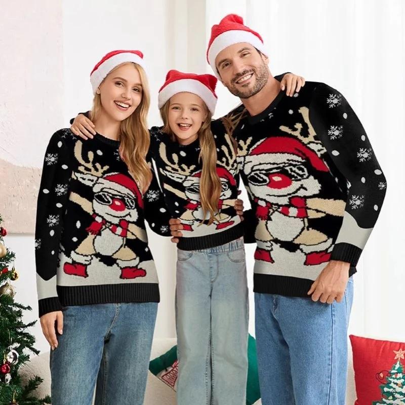 Family wearing matching reindeer Christmas sweaters and Santa hats in festive indoor setting