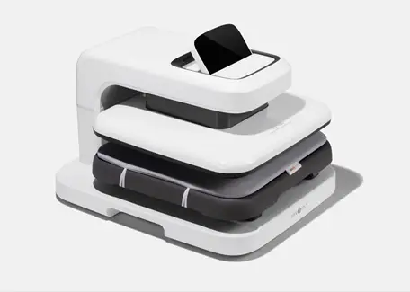 Modern white garment pressing machine with digital control panel on neutral background