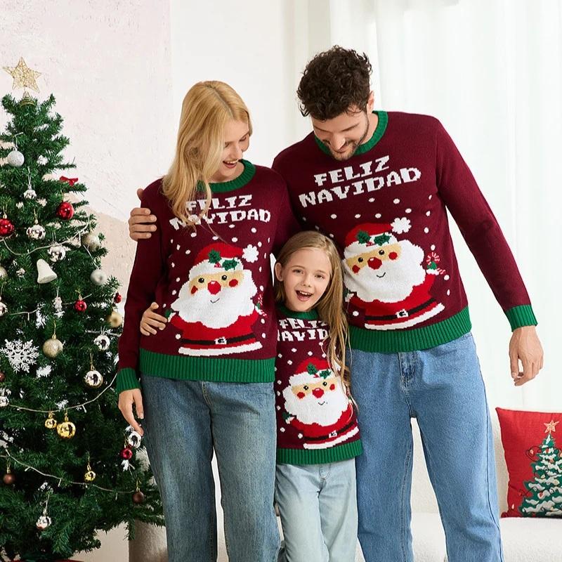 Family in matching holiday sweaters standing beside decorated Christmas tree indoors